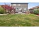 Beautifully landscaped backyard with a patio area, perfect for outdoor enjoyment at 9084 Ellis Way, Arvada, CO 80005