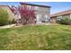 Spacious backyard with lush green lawn and a lovely patio area at 9084 Ellis Way, Arvada, CO 80005