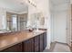 Bathroom featuring a vanity with sink and walk-in shower at 9084 Ellis Way, Arvada, CO 80005