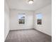 Empty bedroom with two windows allowing ample natural light at 9084 Ellis Way, Arvada, CO 80005