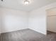 Empty bedroom showcasing neutral walls and carpet, with a walk-in closet at 9084 Ellis Way, Arvada, CO 80005