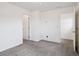 Spacious bedroom with two doors and neutral color scheme at 9084 Ellis Way, Arvada, CO 80005