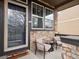 Charming front porch with stylish seating, creating a welcoming entrance at 9084 Ellis Way, Arvada, CO 80005
