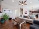 Bright living room boasts hardwood floors, a comfortable sofa, and a decorative coffee table at 9084 Ellis Way, Arvada, CO 80005