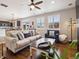 Inviting living room with a cozy sofa, natural light, and a view of the dining area at 9084 Ellis Way, Arvada, CO 80005