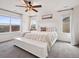Serene main bedroom features soft colors, plush bedding, and abundant natural light at 9084 Ellis Way, Arvada, CO 80005