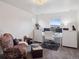 Bright office space with dual monitors, desk, and comfortable seating area at 9084 Ellis Way, Arvada, CO 80005