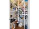 Well-organized walk-in pantry with ample shelving for storage at 9084 Ellis Way, Arvada, CO 80005