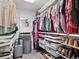 Organized walk-in closet with ample shelving and hanging space for clothes and accessories at 9084 Ellis Way, Arvada, CO 80005