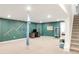Basement with unique design elements including decorative wall features and aerial yoga setup at 5962 S Sheridan Way, Littleton, CO 80123