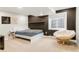 Cozy bedroom with a dark accent wall, window, and comfortable seating at 5962 S Sheridan Way, Littleton, CO 80123