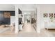 Bright and spacious foyer with a stylish console table, leading into an open-concept living area at 5962 S Sheridan Way, Littleton, CO 80123