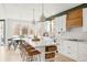 Bright, open kitchen with a large island, modern appliances, and an adjacent breakfast nook with a view at 5962 S Sheridan Way, Littleton, CO 80123