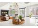 Bright living room with a statement fireplace, large windows, and modern decor at 5962 S Sheridan Way, Littleton, CO 80123