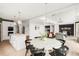 Open-concept living space with modern kitchen island, dining area, and inviting living room at 5962 S Sheridan Way, Littleton, CO 80123