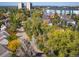 Scenic aerial view of the neighborhood with lush trees and modern apartment buildings at 1355 S Ulster St, Denver, CO 80231