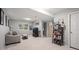 Carpeted basement with a couch and entertainment area at 1355 S Ulster St, Denver, CO 80231