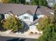 Charming townhome with manicured landscaping, inviting curb appeal, and an attached two-car garage at 1355 S Ulster St, Denver, CO 80231