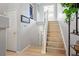 Hallway with staircase and door leading outside at 1355 S Ulster St, Denver, CO 80231