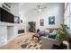 Bright living room featuring a cozy fireplace, neutral paint, and ample space for comfortable seating at 1355 S Ulster St, Denver, CO 80231