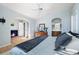 Bright main bedroom with vaulted ceilings and an arched entrance to the ensuite bath at 1355 S Ulster St, Denver, CO 80231
