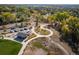 Overhead view of the community park with walking paths, a shelter, and colorful foliage at 1355 S Ulster St, Denver, CO 80231