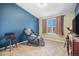 Relaxing room with comfortable massage chair, soft carpeting, and a window with natural light at 11620 W 62Nd Pl # 201, Arvada, CO 80004