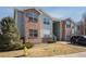 Modern two-story condo featuring brick accents and fresh landscaping at 11620 W 62Nd Pl # 201, Arvada, CO 80004