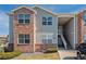 Inviting multi-level condo featuring a mix of brick and siding and a charming entrance staircase at 11620 W 62Nd Pl # 201, Arvada, CO 80004