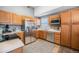 Functional kitchen with stainless steel refrigerator and light wood cabinetry, offering ample counter space at 11620 W 62Nd Pl # 201, Arvada, CO 80004