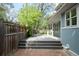 Wooden deck leads to a brick patio and fenced yard, offering a private outdoor retreat at 539 Baker St, Longmont, CO 80501