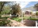 This outdoor space offers a mix of gravel paths, stone patio, pergola, and lush landscaping at 539 Baker St, Longmont, CO 80501