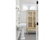 Charming bathroom has a pedestal sink and an antique-style cabinet for a vintage feel at 539 Baker St, Longmont, CO 80501