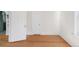 Hardwood floors flow through this bright bedroom, featuring an open doorway at 539 Baker St, Longmont, CO 80501
