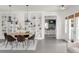 Bright dining room features a stylish oval table, modern chairs, and decorative built-in shelving at 539 Baker St, Longmont, CO 80501