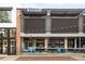 Trendy Teocalli Cocina restaurant with black awnings, outdoor seating and blue accents at 539 Baker St, Longmont, CO 80501