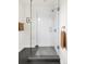 Modern shower with glass door and gray tile at 539 Baker St, Longmont, CO 80501