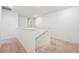 Upstairs hallway with neutral walls and carpeted floors provides access to the bedrooms at 1107 Sunrise Dr, Brighton, CO 80603