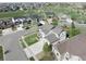 Aerial view of a two-story home in a neighborhood setting with easy access to a large park at 404 Dusk Ct, Erie, CO 80516