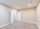Spacious carpeted bedroom features recessed lighting, neutral walls and bi-fold closet doors at 404 Dusk Ct, Erie, CO 80516