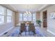 Elegant dining room with large bay window and stylish chandelier, perfect for entertaining at 404 Dusk Ct, Erie, CO 80516