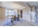 Elegant dining room with modern chandelier, bay window, and stylish decor at 404 Dusk Ct, Erie, CO 80516
