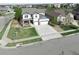 Beautiful two-story home with a well-maintained lawn and a spacious three-car garage at 404 Dusk Ct, Erie, CO 80516