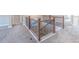 Hallway with carpeted floor and a wood and iron railing overlooking the staircase at 404 Dusk Ct, Erie, CO 80516