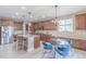 Modern kitchen with granite countertops, stainless steel appliances, and an eat-in dining area at 404 Dusk Ct, Erie, CO 80516