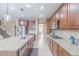 Bright and spacious kitchen with a large center island, stainless steel appliances, and ample cabinet space at 404 Dusk Ct, Erie, CO 80516