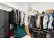 Well-organized walk-in closet that includes hanging storage, shelving, and ample space for shoes and accessories at 17247 E 103Rd Ave, Commerce City, CO 80022