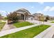 Lovely home with a well-kept lawn, tasteful landscaping, and a paved walkway leading to the front door at 17247 E 103Rd Ave, Commerce City, CO 80022
