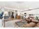 Bright, open-concept living space showcasing a kitchen with an island and modern appliances, ideal for entertaining at 17247 E 103Rd Ave, Commerce City, CO 80022