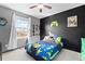 Fun bedroom with a full-size bed and themed decor at 18861 E 58Th Ave # C, Denver, CO 80249